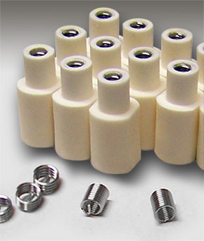 Ceramic components with helical inserts